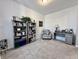 Bright home office with carpeted floors featuring bookshelves, a desk, and an accent chair at 1380 Delacorte Cir, Shelbyville, IN 46176