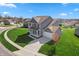 Beautiful aerial view of a gray two-story home with a well-kept lawn and a two-car garage at 145 Stamford Dr, Pittsboro, IN 46167