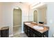 Bathroom with double sink vanity, large mirror and walk-in closet at 145 Stamford Dr, Pittsboro, IN 46167
