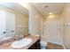 Bathroom featuring a vanity with a brown countertop, a mirror, and a shower-tub combo at 145 Stamford Dr, Pittsboro, IN 46167