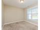 Bedroom featuring neutral walls, carpet flooring, and a window with blinds at 145 Stamford Dr, Pittsboro, IN 46167