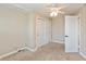 Spacious bedroom with a ceiling fan, closet, and neutral-toned walls with carpet flooring at 145 Stamford Dr, Pittsboro, IN 46167