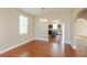 Dining area with hardwood floors, an arched doorway, and a chandelier above the table at 145 Stamford Dr, Pittsboro, IN 46167