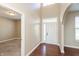 Inviting foyer with hardwood floors, a double door entrance, and arched doorway at 145 Stamford Dr, Pittsboro, IN 46167