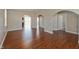 The open-concept living room features beautiful hardwood floors and elegant arched doorways at 145 Stamford Dr, Pittsboro, IN 46167