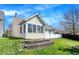 Backyard showcasing a lush lawn, a garden with retaining walls, and a bright home exterior at 14917 Mia Dr, Carmel, IN 46033