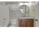 Bathroom featuring a vanity with a framed mirror and a shower-tub combo at 14917 Mia Dr, Carmel, IN 46033