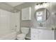 Clean bathroom with a tub, toilet, vanity with sink, and cabinet for storage at 14917 Mia Dr, Carmel, IN 46033