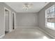 Bright bedroom features neutral walls, a large window and a ceiling fan at 14917 Mia Dr, Carmel, IN 46033