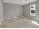 Cozy bedroom with neutral walls, carpet floors, and a window at 14917 Mia Dr, Carmel, IN 46033