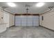 Spacious garage featuring a sectional garage door and plenty of room for parking and storage at 14917 Mia Dr, Carmel, IN 46033