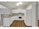 Bright kitchen with white cabinets, laminate countertops, and hard surface floors at 14917 Mia Dr, Carmel, IN 46033
