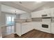 Eat-in kitchen includes white appliances, ample cabinets, laminate countertop and hard surface floors at 14917 Mia Dr, Carmel, IN 46033