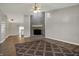 Living room featuring a brick fireplace, ceiling fan, and hard surface floors at 14917 Mia Dr, Carmel, IN 46033