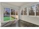 Bright sunroom with multiple windows and a sliding glass door to the yard at 14917 Mia Dr, Carmel, IN 46033