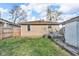 View of the cozy backyard showcasing the home's exterior, and a small area perfect for outdoor seating at 1504 S Lynhurst Dr, Indianapolis, IN 46241