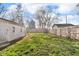 Spacious backyard featuring a new wooden fence and a detached garage offering privacy and ample outdoor space at 1504 S Lynhurst Dr, Indianapolis, IN 46241