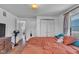 Bedroom with wooden floors, a fan, and closet space at 1504 S Lynhurst Dr, Indianapolis, IN 46241