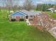 Charming home featuring a brick and blue exterior, an attached garage, and a well-maintained lawn at 1737 W 200 N, Greenfield, IN 46140