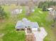 Aerial view of the residence featuring a brick and blue exterior with a well manicured lawn at 1737 W 200 N, Greenfield, IN 46140