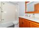 Bathroom featuring a bath with shower, white countertop sink, and wood vanity at 1737 W 200 N, Greenfield, IN 46140