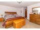 Comfortable bedroom with a wooden bed, chest, and side table at 1737 W 200 N, Greenfield, IN 46140