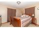 Cozy bedroom with a comfortable bed, side table, and warm lighting at 1737 W 200 N, Greenfield, IN 46140