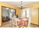 Dining room features a table with seating for four and lots of light, with a view into a living room at 1737 W 200 N, Greenfield, IN 46140