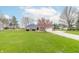 A charming single-story brick home with a well-maintained lawn and a long driveway at 1737 W 200 N, Greenfield, IN 46140