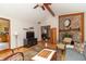 Bright living room featuring hardwood floors, brick fireplace, and lots of natural light from skylights and windows at 1737 W 200 N, Greenfield, IN 46140