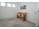 Cozy carpeted room with ample natural light, accent chair, and neutral wall decor at 182 Batteese Dr, Cicero, IN 46034