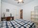 Cozy bedroom with desk area, plush carpet, and ceiling fan provides comfortable space for sleeping and studying at 182 Batteese Dr, Cicero, IN 46034