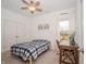 Cozy bedroom with desk area, plush carpet, and ceiling fan provides comfortable space for sleeping and studying at 182 Batteese Dr, Cicero, IN 46034