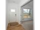 Bright entryway welcomes you with hardwood floors and views of a sunlit room at 182 Batteese Dr, Cicero, IN 46034