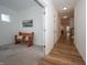 Hallway showcases the bright, airy layout of the home and transitions from carpet to hardwood at 182 Batteese Dr, Cicero, IN 46034