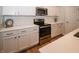Modern kitchen featuring stainless steel appliances, white subway tile backsplash, and white quartz countertops at 182 Batteese Dr, Cicero, IN 46034