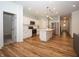 Open-concept kitchen features stainless steel appliances, white cabinetry, and center island at 182 Batteese Dr, Cicero, IN 46034