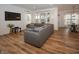 Sun-filled living room boasts hardwood floors, recessed lighting, and comfortable sectional seating at 182 Batteese Dr, Cicero, IN 46034