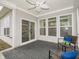 Covered patio with outdoor seating and a view of the backyard through sliding glass doors at 182 Batteese Dr, Cicero, IN 46034