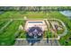Overhead view of community center pool and playground with surrounding lawns, pond, and walking paths at 1950 Midnight Pass, Brownsburg, IN 46112
