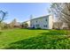 Expansive grassy backyard featuring a patio area, offering ample space for outdoor activities and enjoyment at 1950 Midnight Pass, Brownsburg, IN 46112