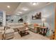 Spacious finished basement features a comfortable seating area and exercise equipment at 1950 Midnight Pass, Brownsburg, IN 46112