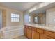 Bright bathroom features double vanity, soaking tub, and glass enclosed shower at 1950 Midnight Pass, Brownsburg, IN 46112