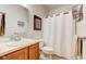 Bathroom featuring a vanity with a neutral-toned countertop, toilet and shower at 1950 Midnight Pass, Brownsburg, IN 46112