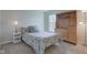 Comfortable bedroom with built-in storage, window and carpet floors at 1950 Midnight Pass, Brownsburg, IN 46112
