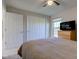 Cozy bedroom with neutral colors, closet, window and ceiling fan with light at 1950 Midnight Pass, Brownsburg, IN 46112