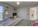 Bright bedroom with built in shelving and a large window at 1950 Midnight Pass, Brownsburg, IN 46112