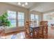 Well-lit dining room with hardwood floors and a wooden table and chairs set at 1950 Midnight Pass, Brownsburg, IN 46112