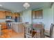 Bright kitchen with central island, stainless steel appliances, and a seamless connection to the dining area at 1950 Midnight Pass, Brownsburg, IN 46112