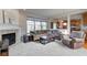 Inviting living room featuring a cozy fireplace and large windows at 1950 Midnight Pass, Brownsburg, IN 46112